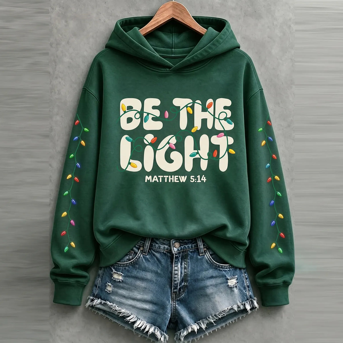 Cardydony Women's Faith Inspired Be The Light Christmas Lights Relaxed Fit Green Pullover Hoodie